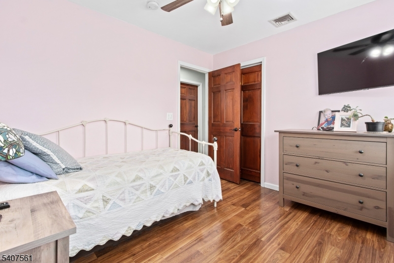 30 Lanning Road Blairstown, NJ 07825 - Photo 22 of 40 a bedroom with a bed and a flat screen tv