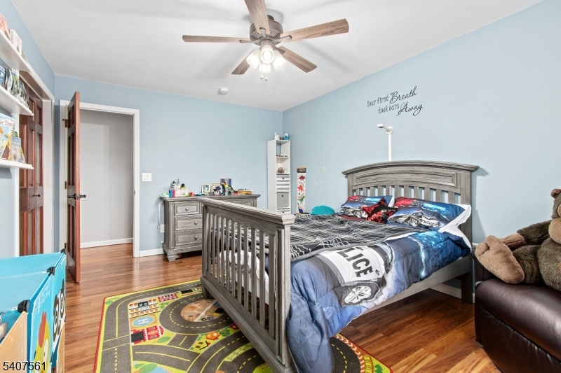 30 Lanning Road Blairstown, NJ 07825 - Photo 24 of 40 a bedroom with furniture and a chandelier