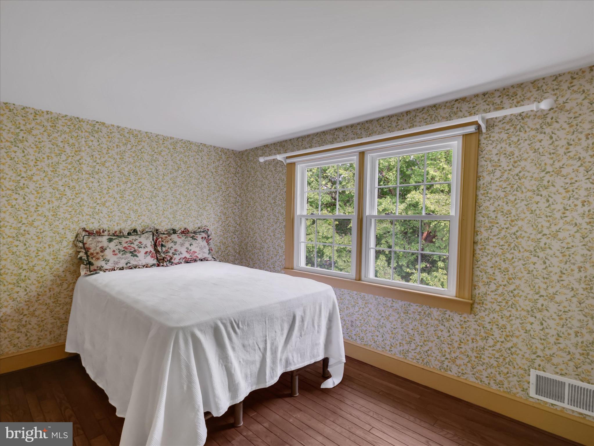 19255 Telegraph Springs Road Purcellville, VA 20132 - Photo 36 of 107 a bedroom with a bed and a window