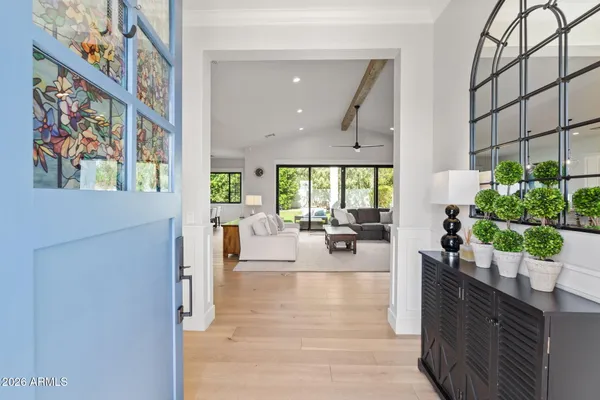 a kitchen with stainless steel appliances granite countertop a stove and white cabinets