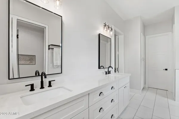 a bedroom with bed and a window