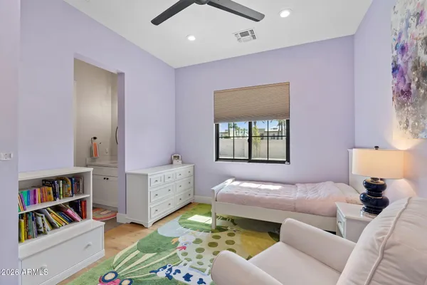 a bedroom with furniture and a window