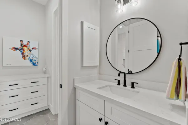 a view of a house with a big yard and large trees