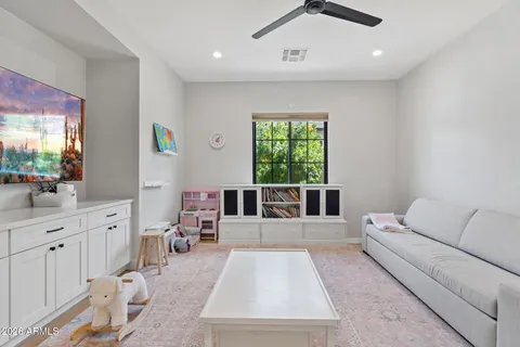 a living room with furniture and windows