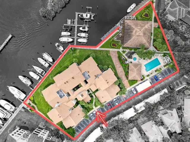 an aerial view of house with yard swimming pool and outdoor seating