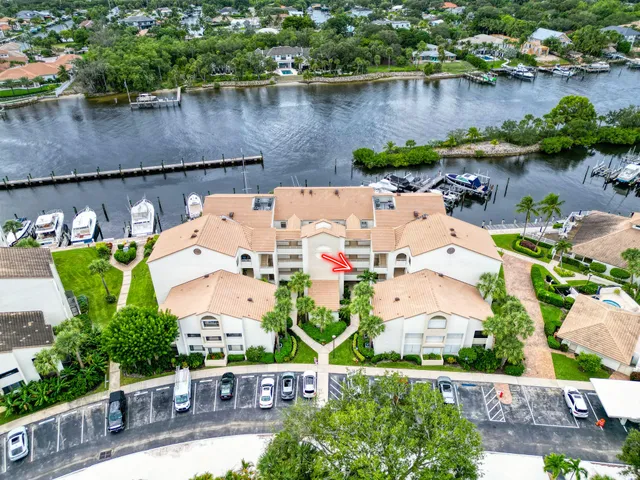a view of a lake with a house swimming pool and outdoor space