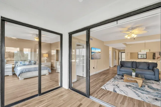 a bedroom with a bed and a chandelier