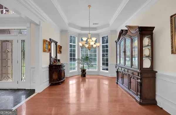 a kitchen with stainless steel appliances granite countertop a refrigerator a oven a sink and a refrigerator