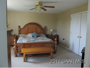 2544 North River Road Bridgewater, VA 22812 - Photo 9 of 20 a bedroom with a bed and a table