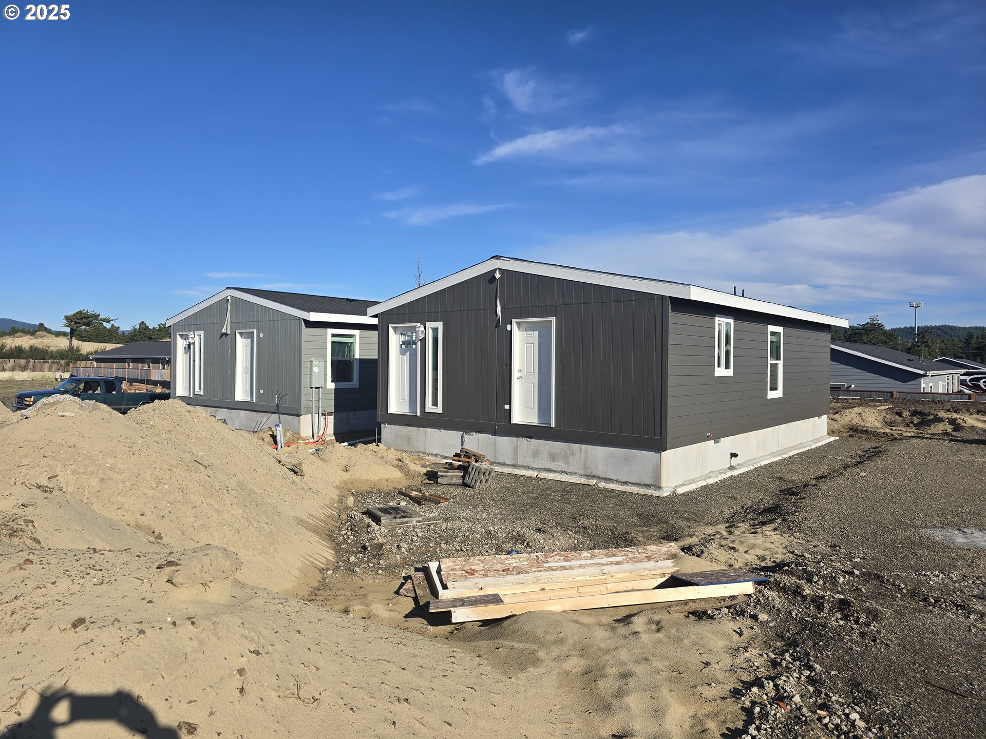 5287 Maple Street Florence, OR 97439 - Photo 3 of 5 a view of a house with a snow in the yard