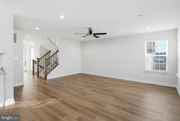 a view of an entryway with wooden floor