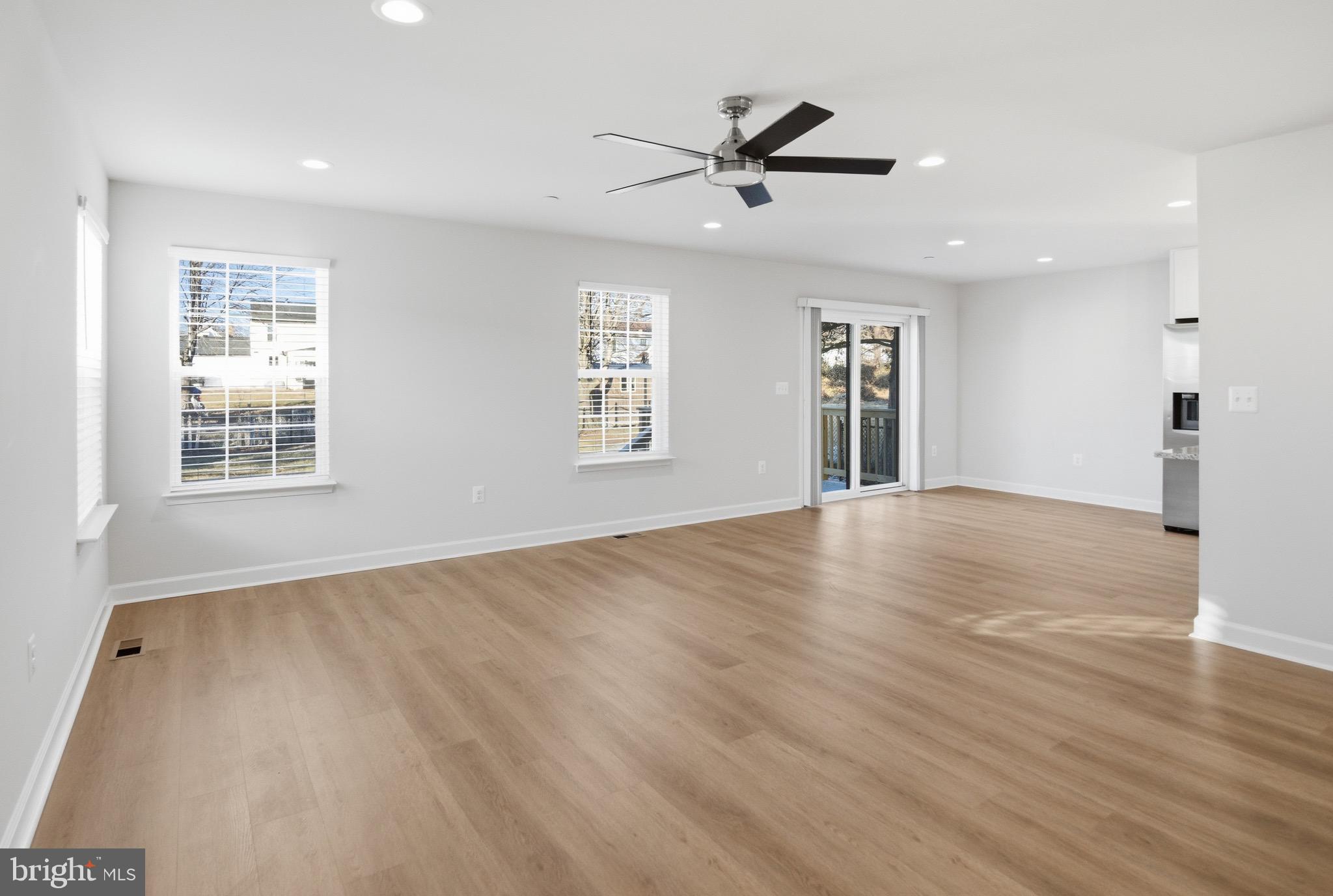 504 Cleveland Road Linthicum Heights, MD 21090 - Photo 14 of 54 a view of empty room with wooden floor and fan