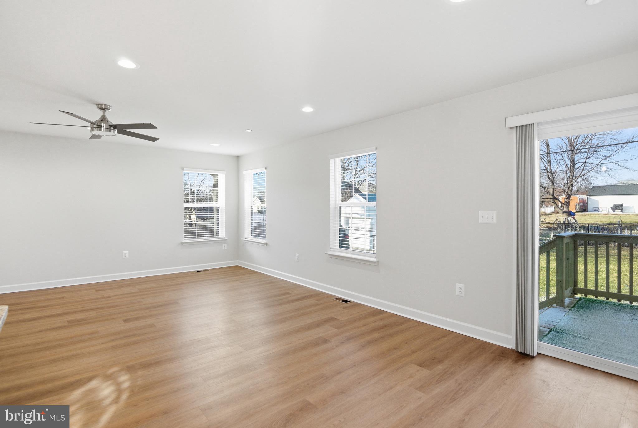 504 Cleveland Road Linthicum Heights, MD 21090 - Photo 15 of 54 wooden floor in an empty room with a window