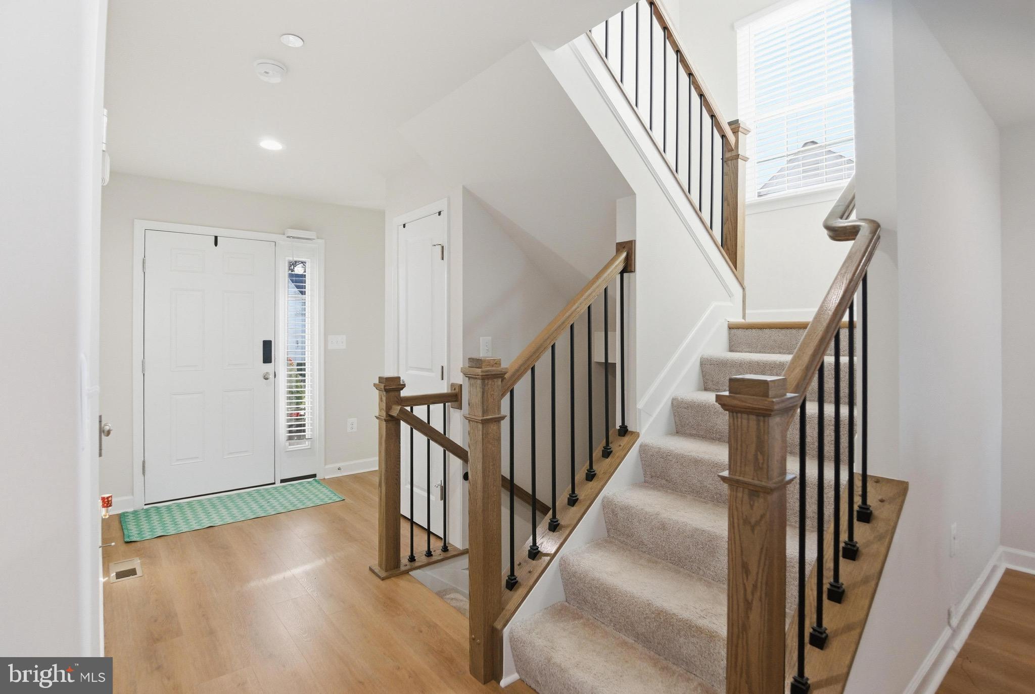 504 Cleveland Road Linthicum Heights, MD 21090 - Photo 18 of 54 a view of staircase with wooden floor and a rug