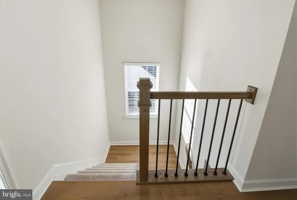 a view of a hallway with staircase
