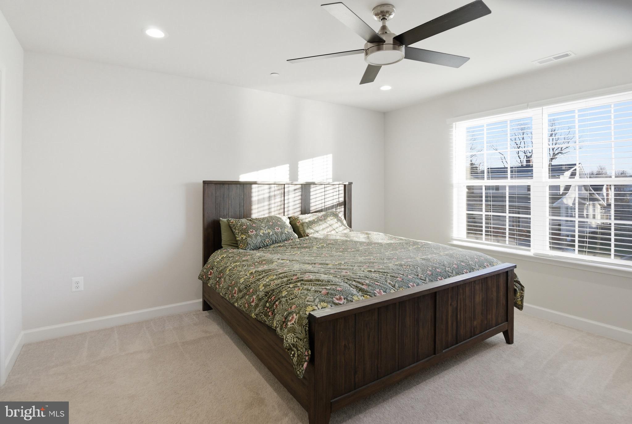 504 Cleveland Road Linthicum Heights, MD 21090 - Photo 22 of 54 a bed sitting in a room next to a window