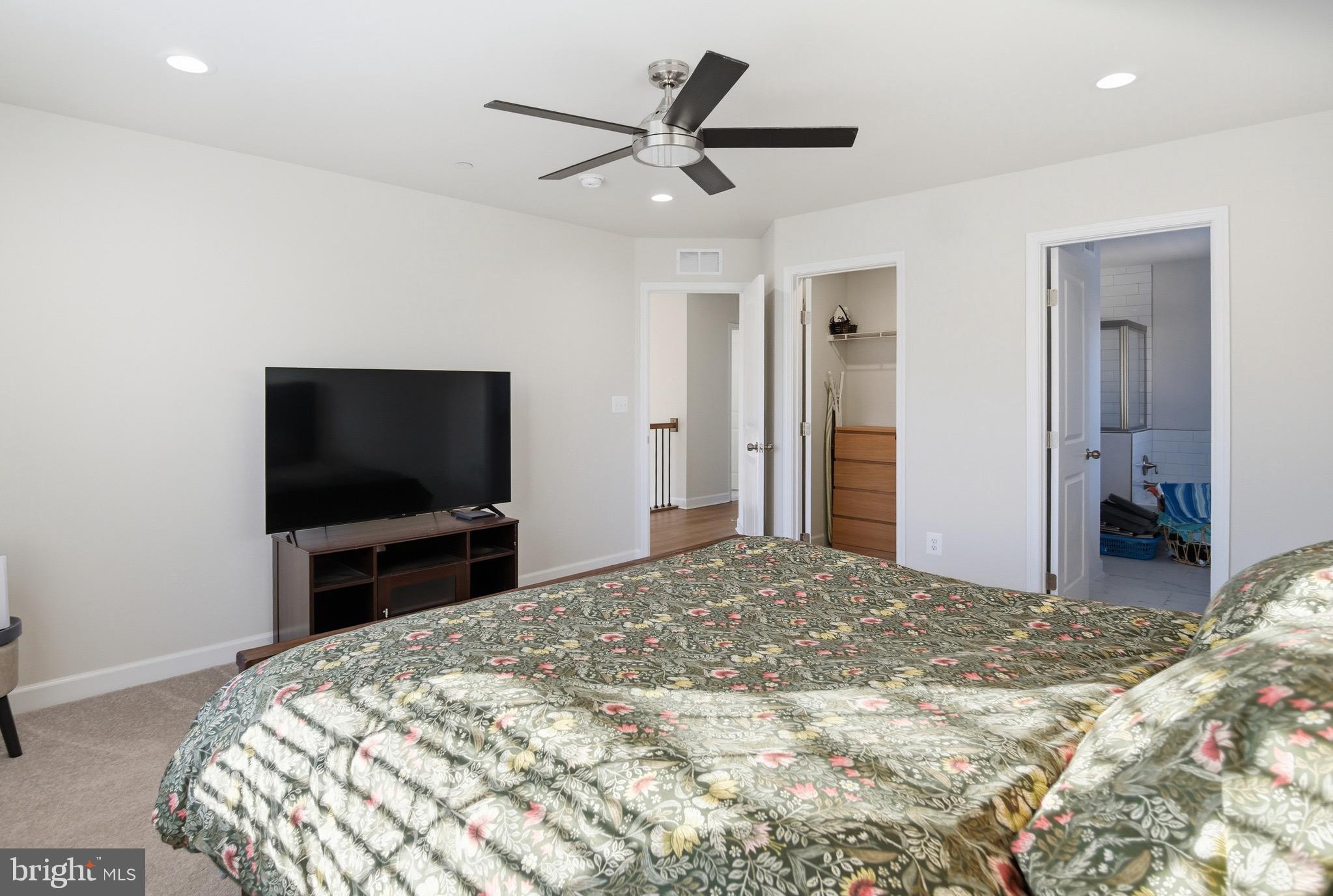 504 Cleveland Road Linthicum Heights, MD 21090 - Photo 24 of 54 a bedroom with a bed and a flat screen tv