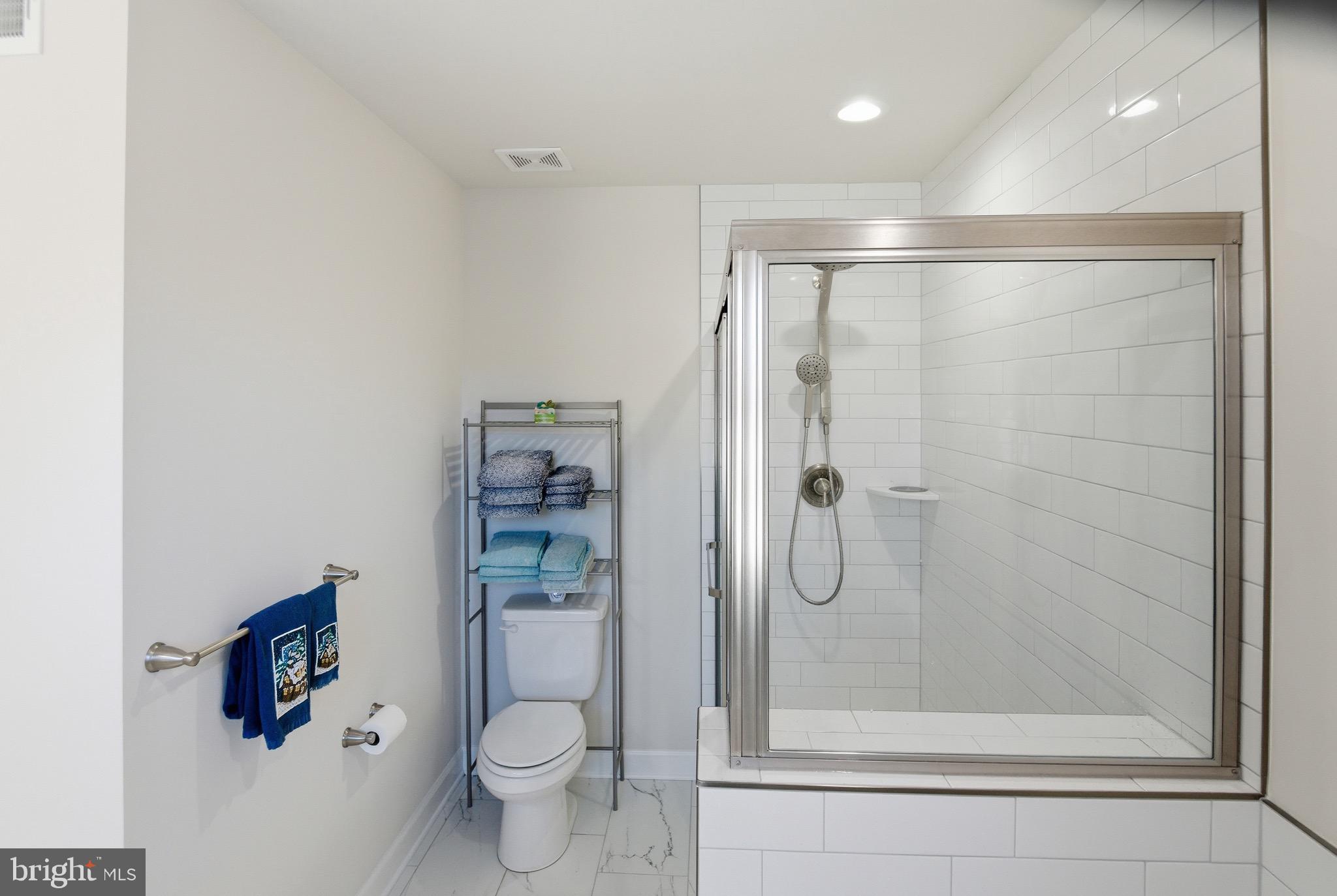 504 Cleveland Road Linthicum Heights, MD 21090 - Photo 28 of 54 a bathroom with a shower and a toilet