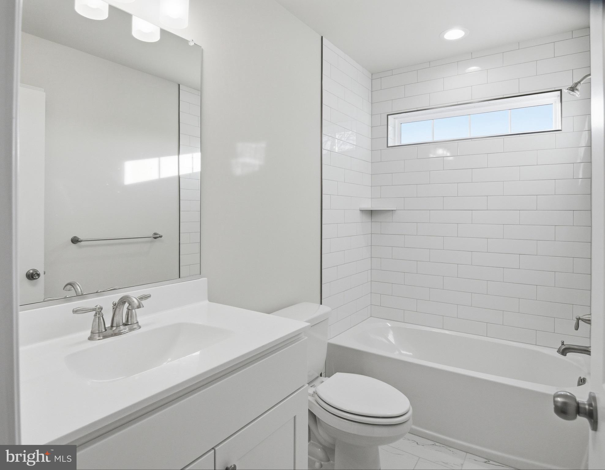 504 Cleveland Road Linthicum Heights, MD 21090 - Photo 30 of 54 a bathroom with a sink toilet and shower