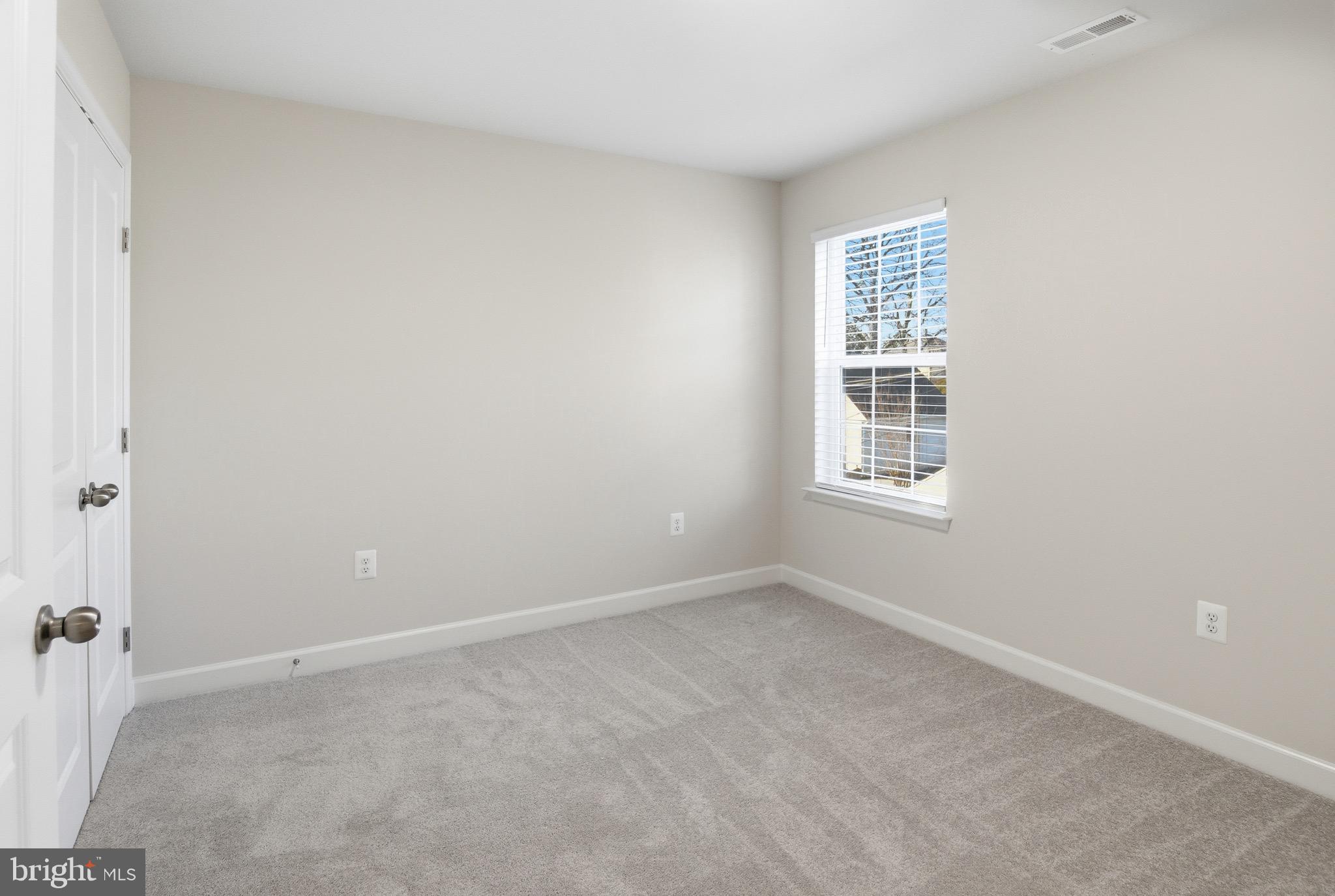 504 Cleveland Road Linthicum Heights, MD 21090 - Photo 32 of 54 a view of an empty room with a window