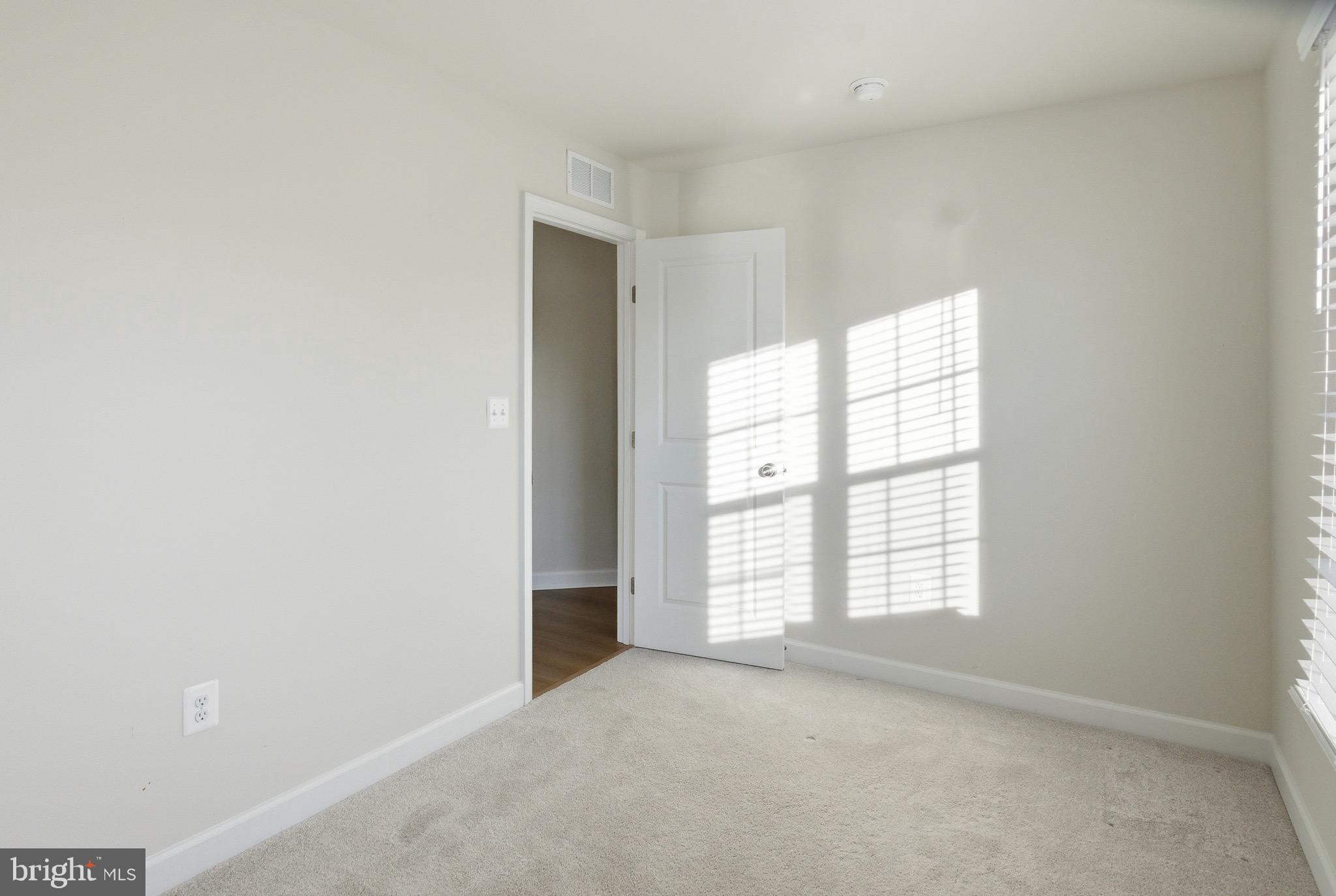 504 Cleveland Road Linthicum Heights, MD 21090 - Photo 37 of 54 an empty room with windows
