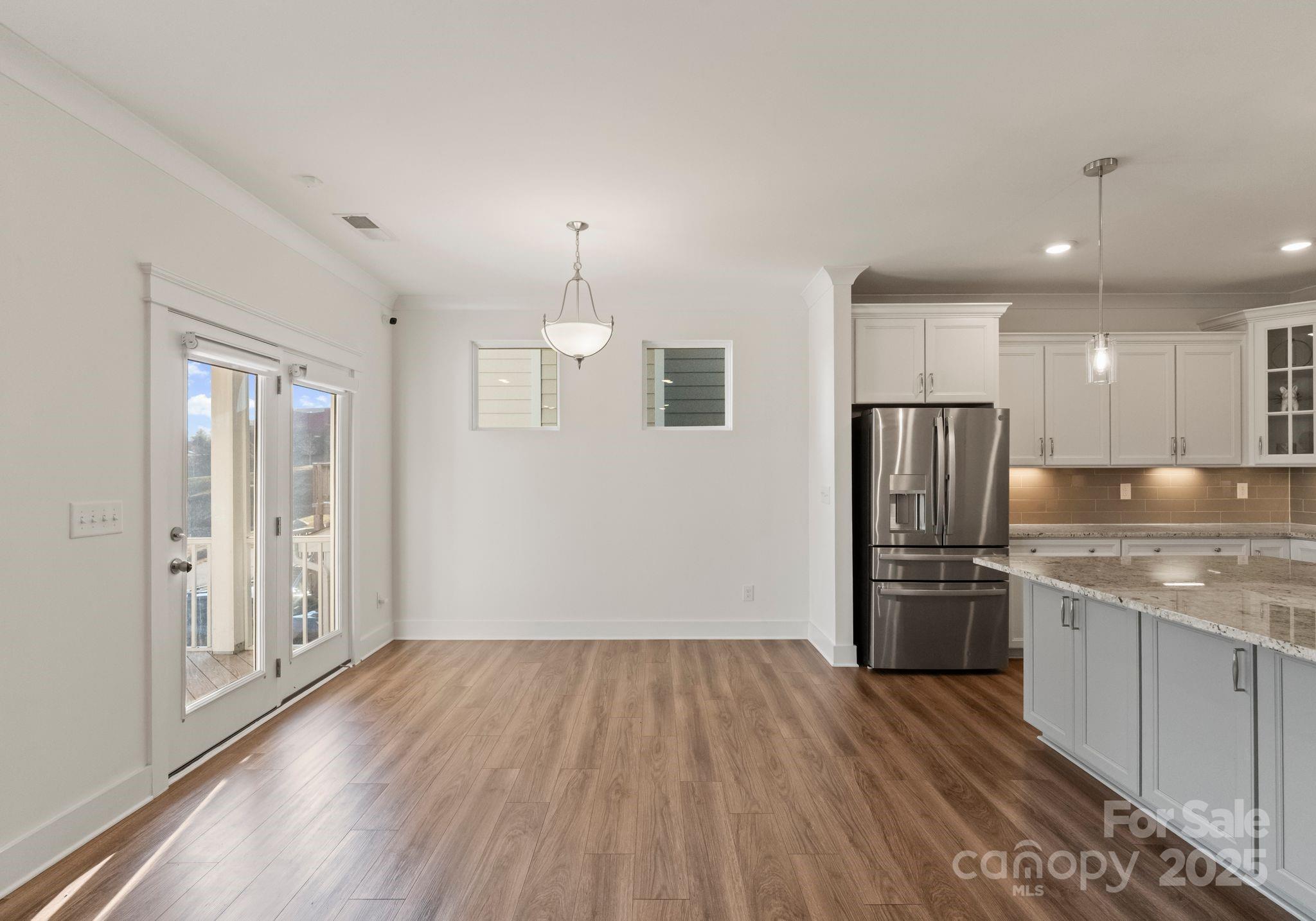 619-r L R L Stowe Road Belmont, NC 28012 - Photo 12 of 33 a kitchen with stainless steel appliances a refrigerator and a hard wood floor
