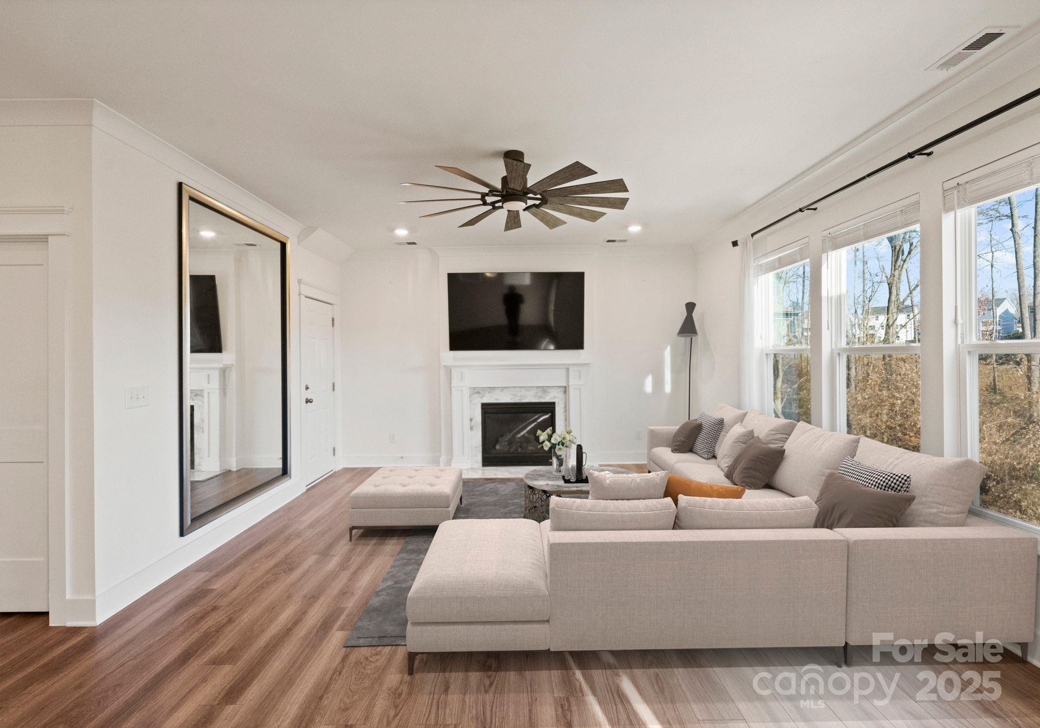 619-r L R L Stowe Road Belmont, NC 28012 - Photo 13 of 33 a living room with furniture a fireplace and a flat screen tv