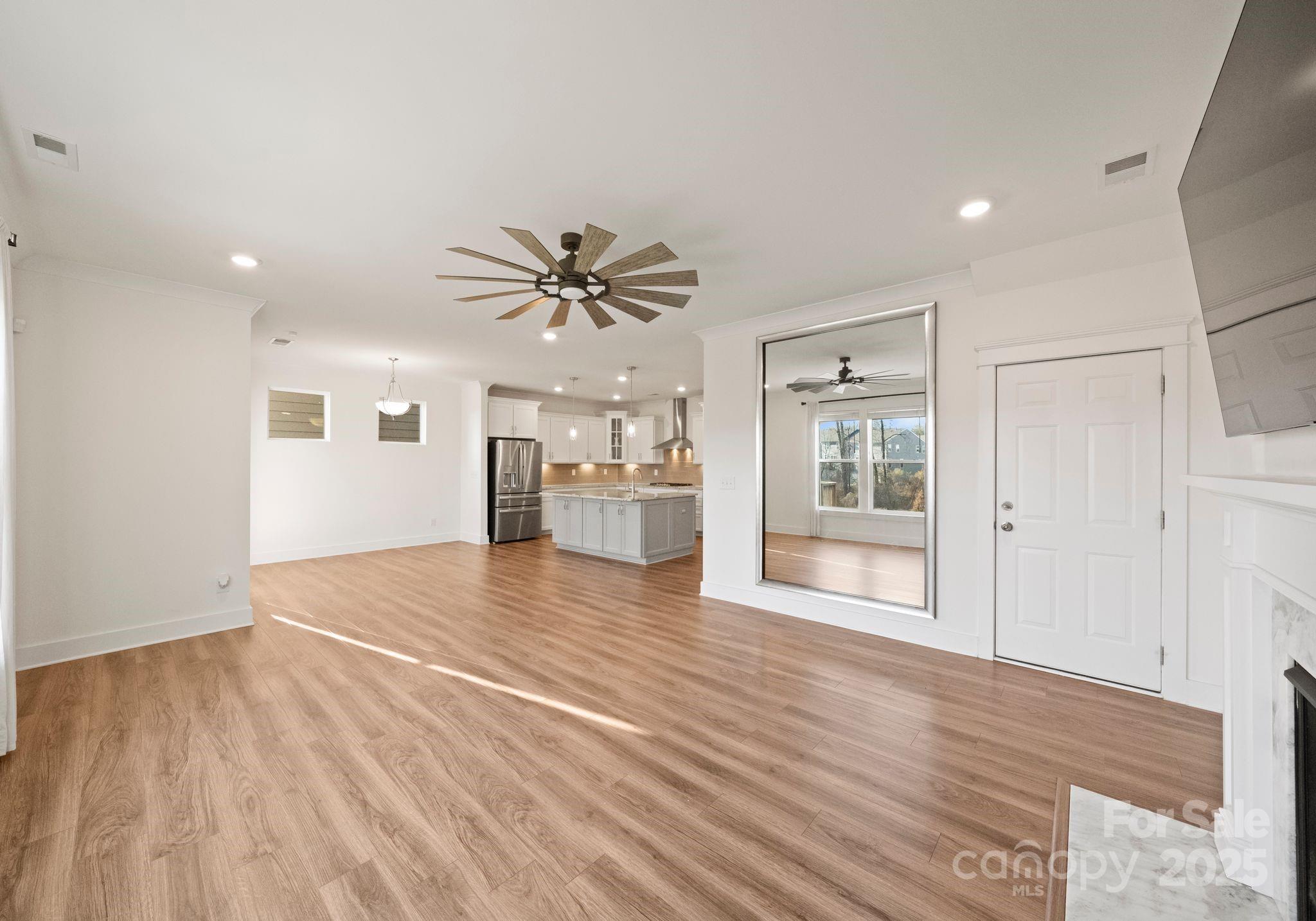 619-r L R L Stowe Road Belmont, NC 28012 - Photo 14 of 33 a view of empty room with wooden floor and window
