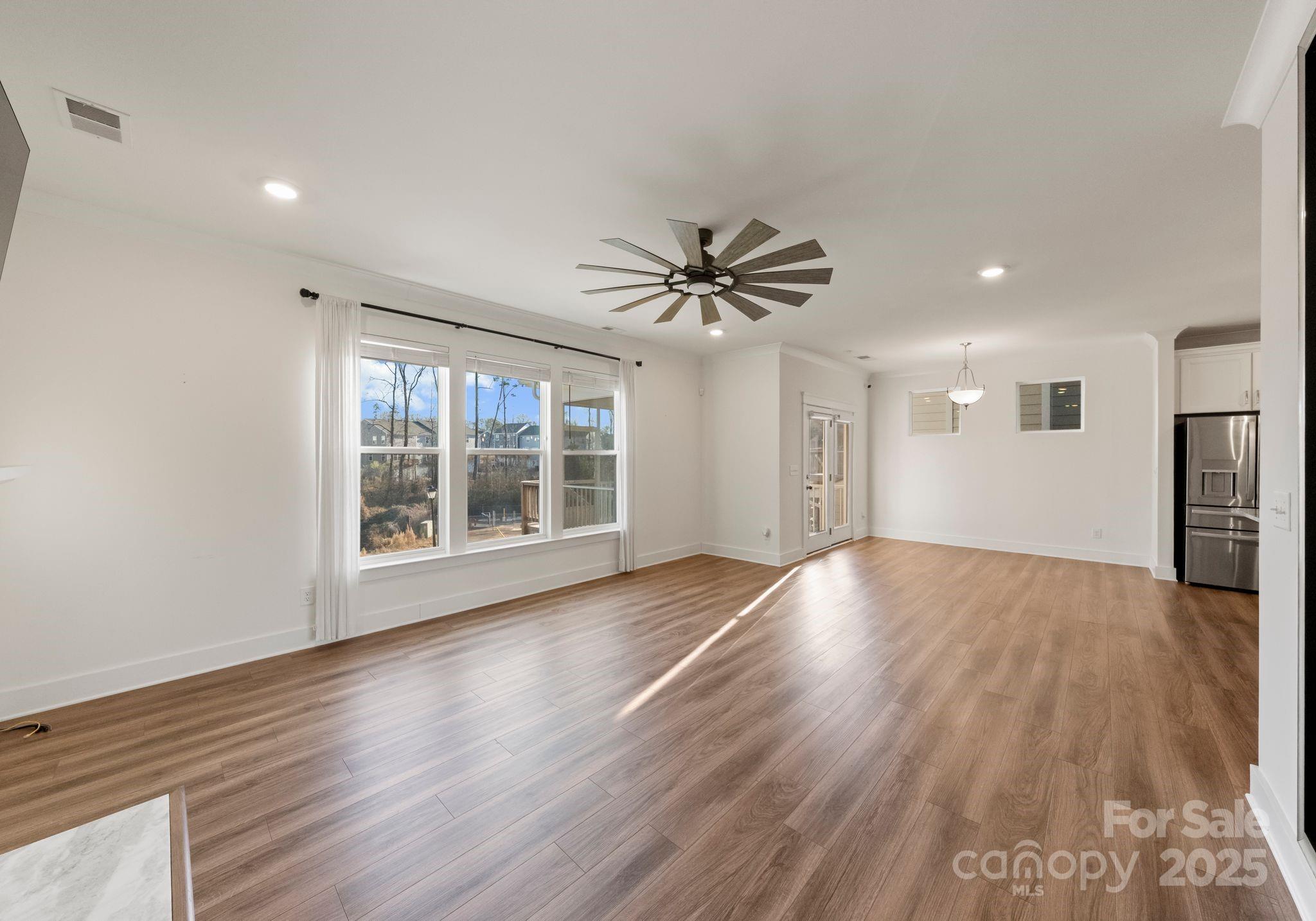 619-r L R L Stowe Road Belmont, NC 28012 - Photo 15 of 33 a view of an empty room with a window and wooden floor