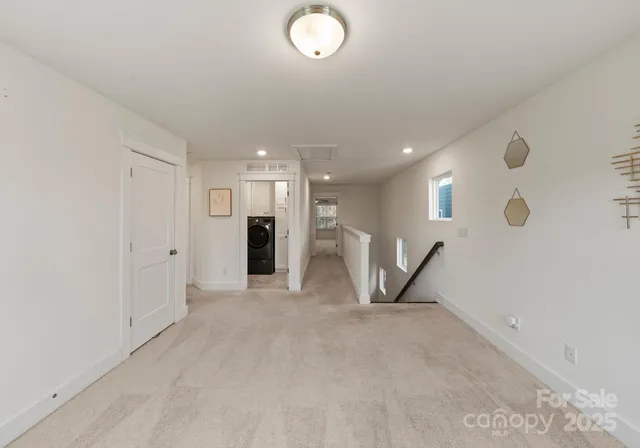 a view of a livingroom with furniture and a ceiling fan