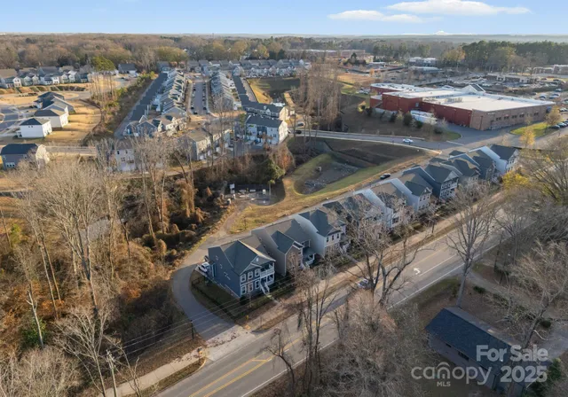 an aerial view of residential building and ocean