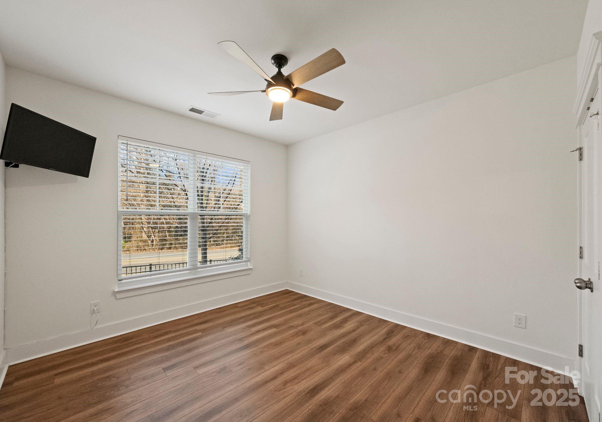 619-r L R L Stowe Road Belmont, NC 28012 - Photo 5 of 33 a view of an empty room with wooden floor and a window