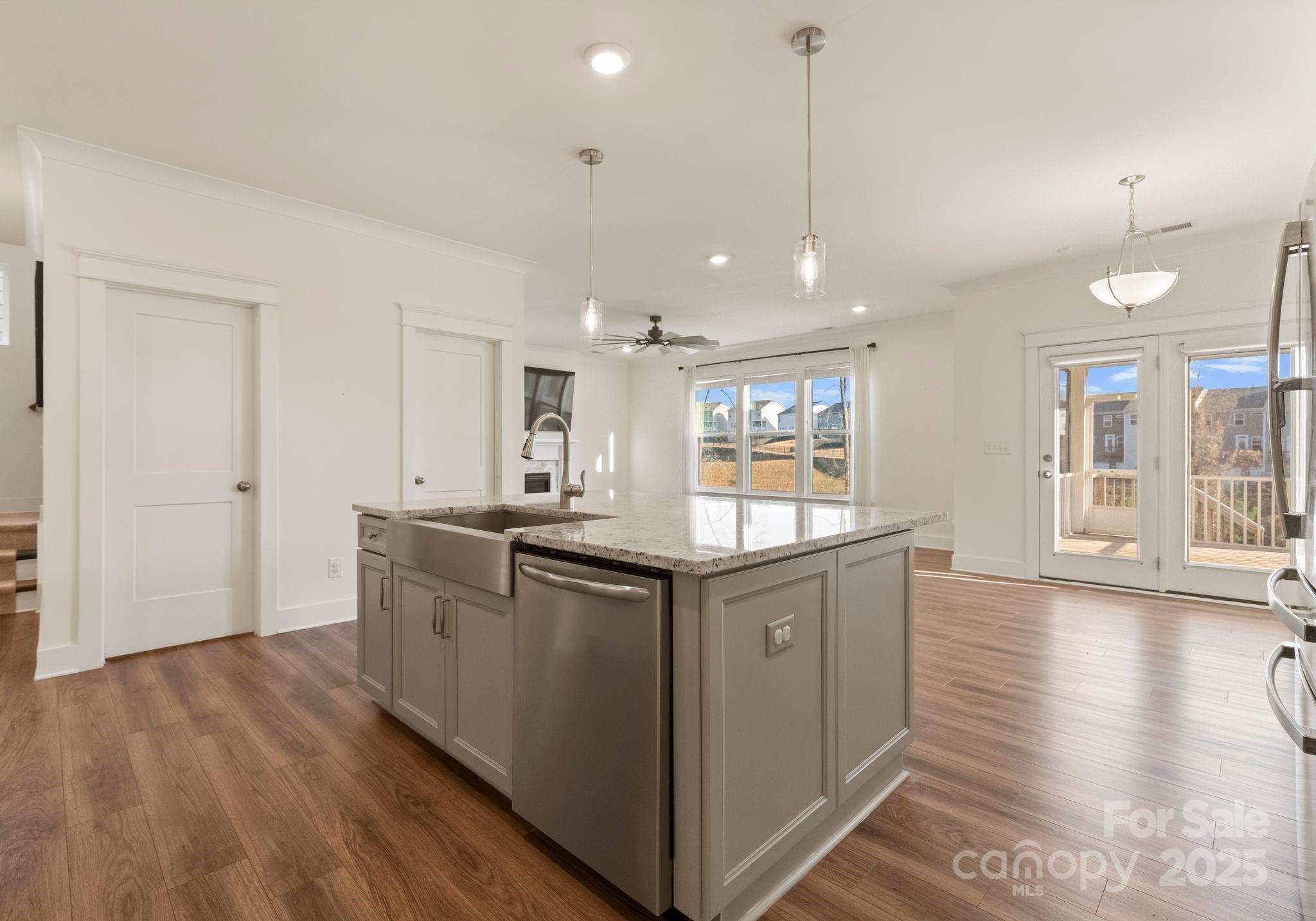 619-r L R L Stowe Road Belmont, NC 28012 - Photo 10 of 33 a kitchen with stainless steel appliances granite countertop a sink a stove and a wooden floors