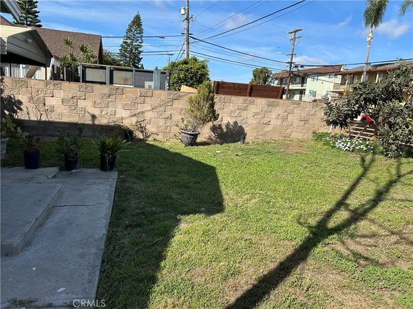 a view of a yard with an outdoor seating