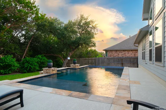 a view of swimming pool with seating space