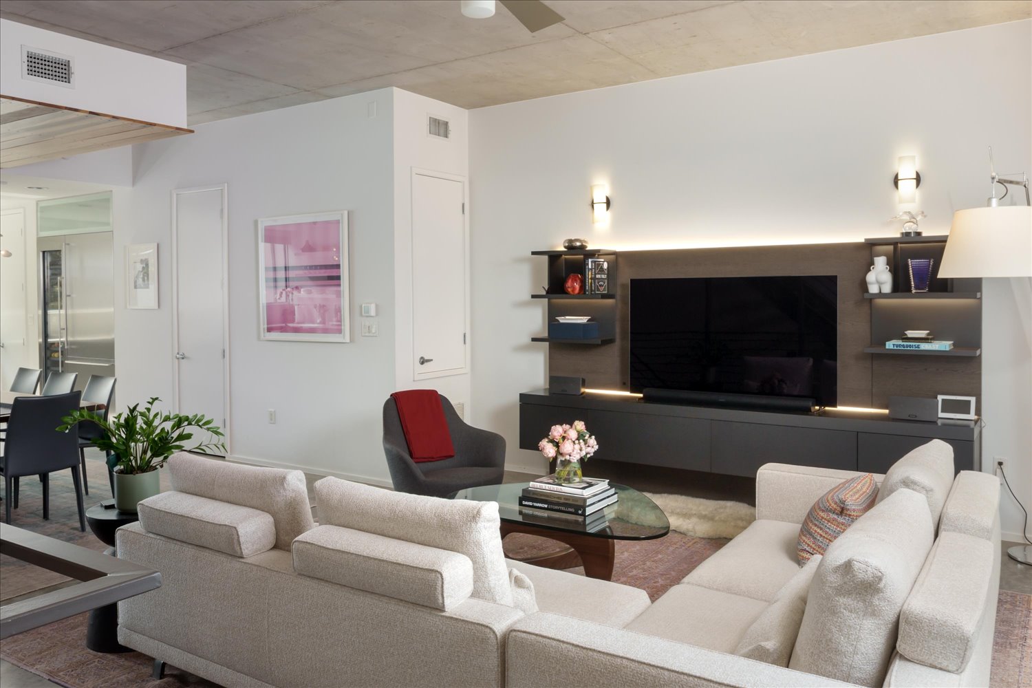 2301 South 5th Street, Unit 11 Austin, TX 78704 - Photo 4 of 24 A built-in Molteni entertainment cabinet showcases impeccable Italian craftsmanship and anchors the space with architectural presence.