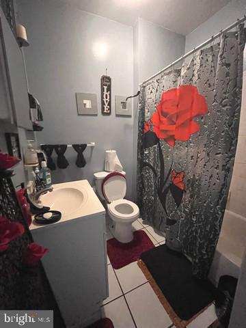 1711 North Pulaski Street Baltimore, MD 21217 - Photo 13 of 14 a bathroom with a sink toilet and shower