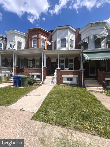 1711 North Pulaski Street Baltimore, MD 21217 - Photo 2 of 14 a front view of a house with garden