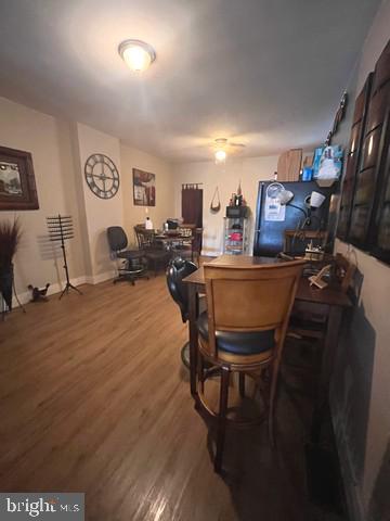 1711 North Pulaski Street Baltimore, MD 21217 - Photo 4 of 14 a living room with furniture a rug and a painting on the wall