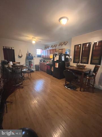 1711 North Pulaski Street Baltimore, MD 21217 - Photo 5 of 14 a living room with furniture and a flat screen tv