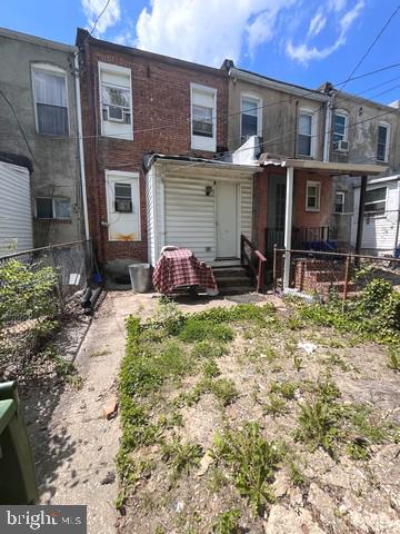 1711 North Pulaski Street Baltimore, MD 21217 - Photo 9 of 14 a front view of a house with patio
