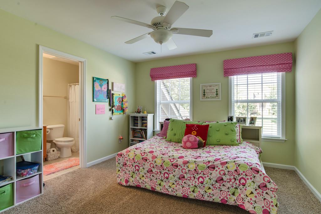 508 Rafe Court Franklin, TN 37064 - Photo 17 of 30 a bedroom with a bed and a chandelier