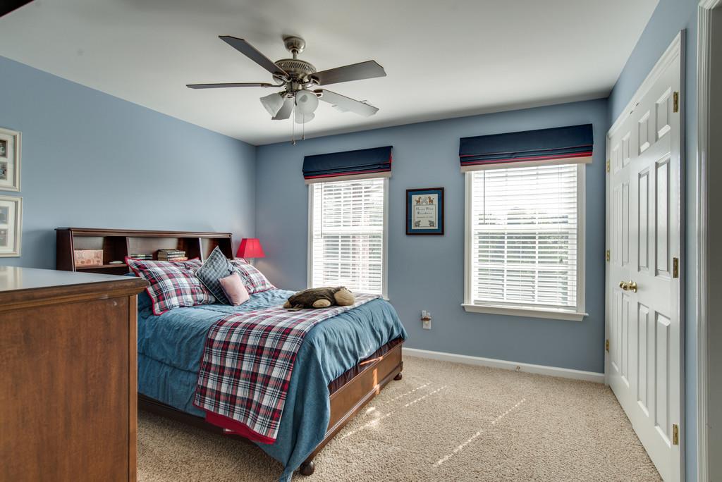 508 Rafe Court Franklin, TN 37064 - Photo 18 of 30 a bedroom with a bed and a chandelier