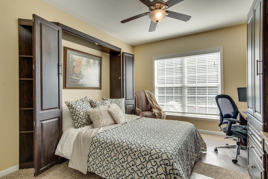 508 Rafe Court Franklin, TN 37064 - Photo 21 of 30 a bedroom with a bed chair and a window