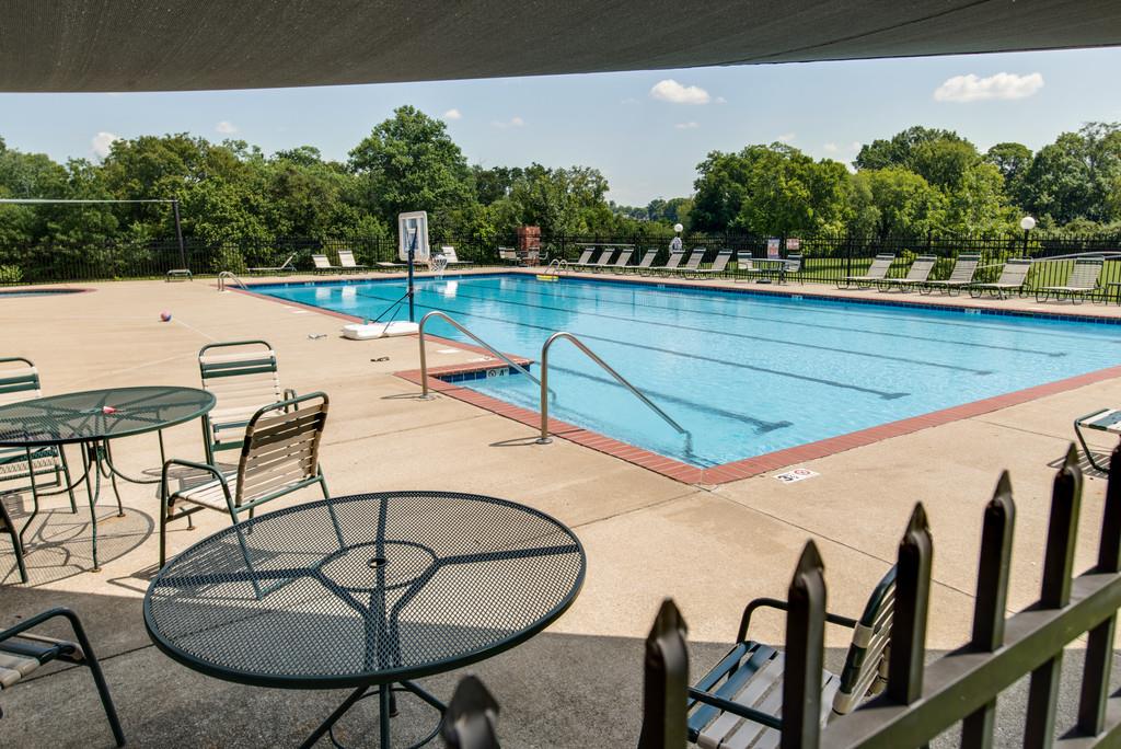 508 Rafe Court Franklin, TN 37064 - Photo 26 of 30 a view of swimming pool with seating area and trees in the background