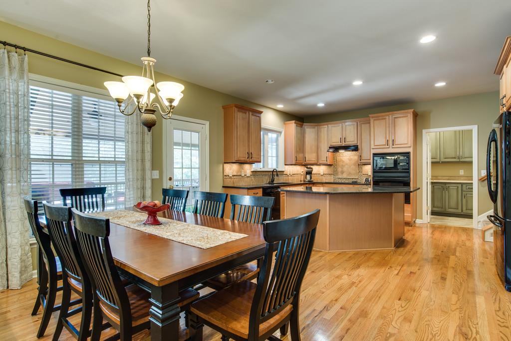 508 Rafe Court Franklin, TN 37064 - Photo 6 of 30 a view of a dining room and livingroom with furniture window wooden floor and a chandelier