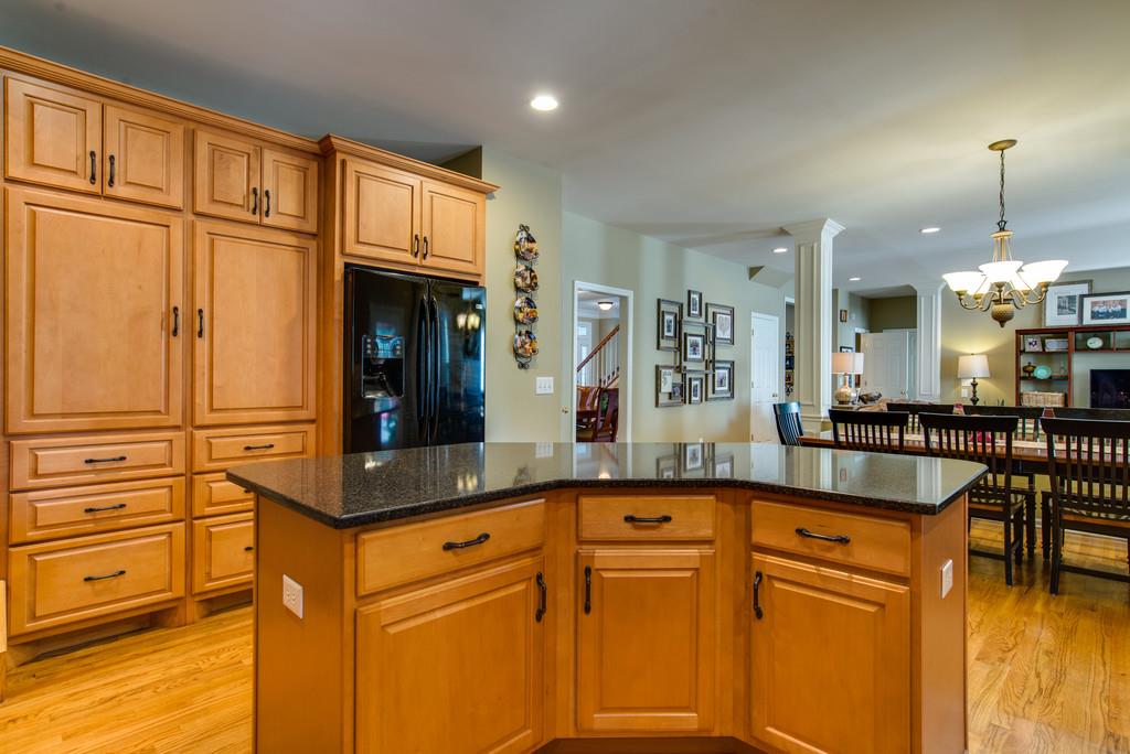 508 Rafe Court Franklin, TN 37064 - Photo 7 of 30 a kitchen with stainless steel appliances granite countertop a sink and cabinets