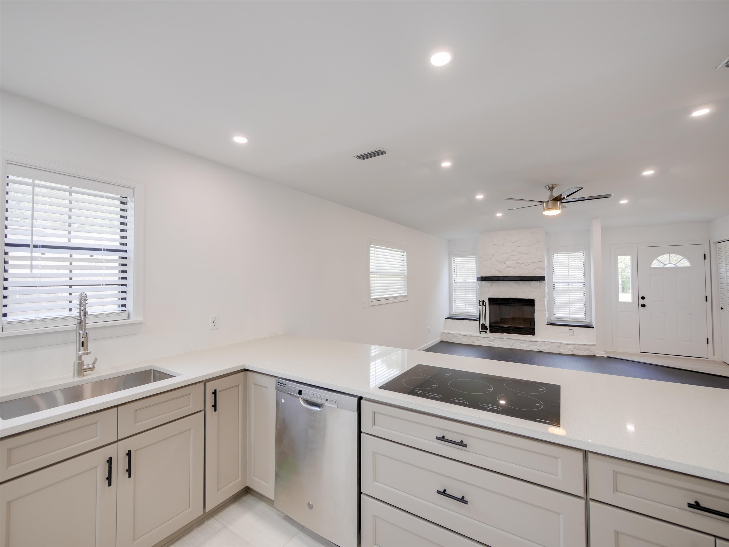 136 Bonita Road St. Augustine, FL 32086 - Photo 11 of 26 a kitchen with kitchen island white cabinets appliances and a sink