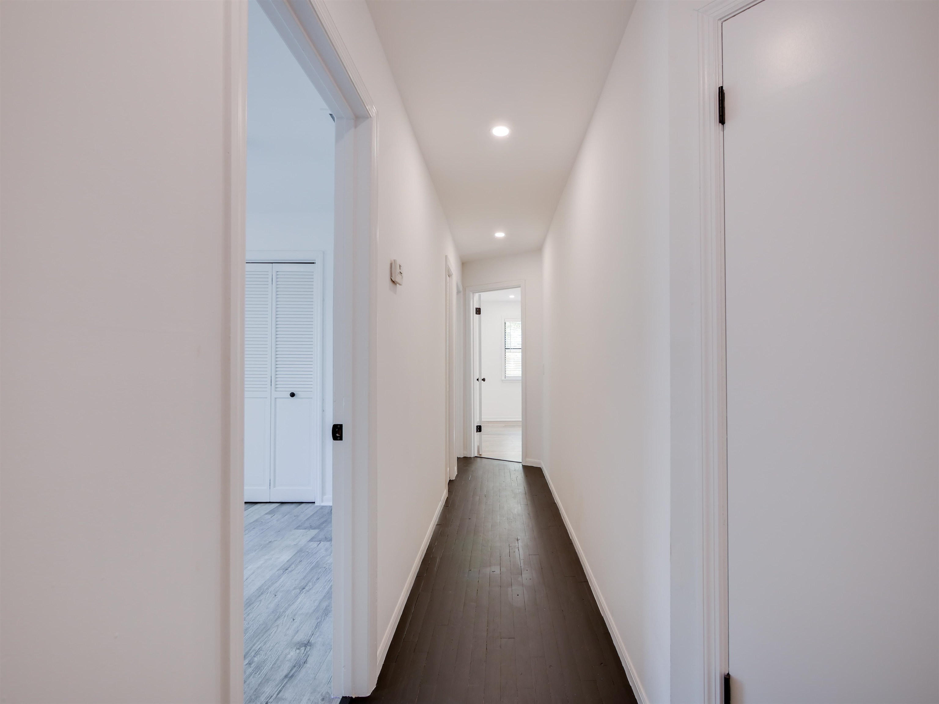 136 Bonita Road St. Augustine, FL 32086 - Photo 12 of 26 a view of a hallway with wooden floor and staircase