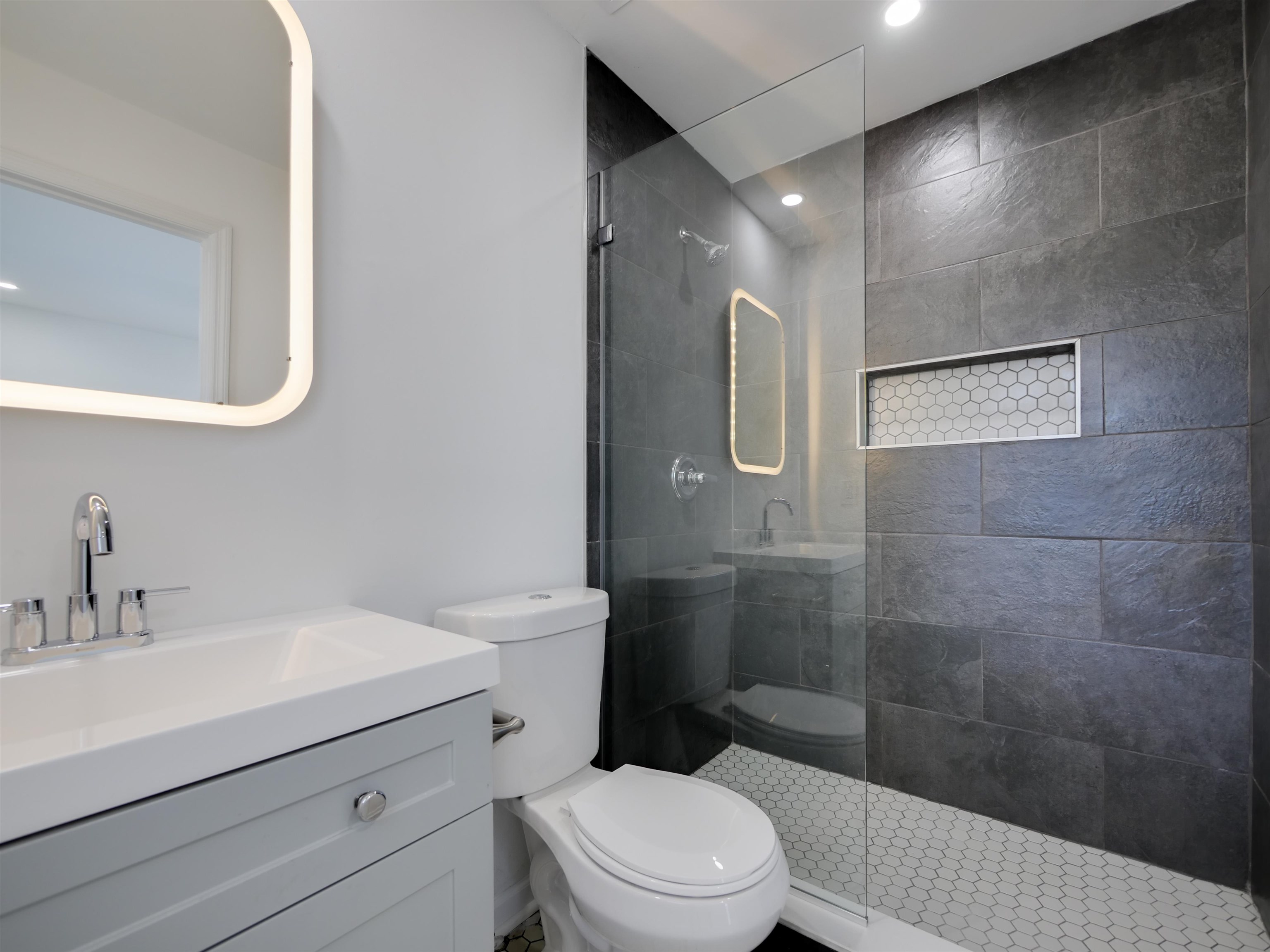 136 Bonita Road St. Augustine, FL 32086 - Photo 16 of 26 a bathroom with a sink a toilet and shower